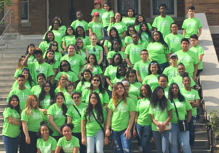 Group of students wearing green t-shirt